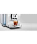 Slick Smart Fully Automatic Coffee Center With Dope Hot And Cold Brew Options Ai Powered Touchscreen Wifi App Control Integrated Grinder Diamond White Finish showcasing iced coffee in glass.