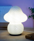 Desert Swirl Mushroom Lamp With Stepless Dimmable Glass Shade, Warm White LED Bulb Included on a wooden bedside table