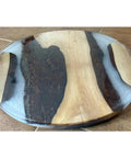 18 Inch Turntable Lazy Susan In Snazzy Walnut With Translucent White Epoxy Rivers on a dining table surface.