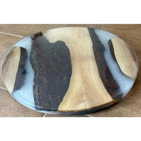 18 Inch Turntable Lazy Susan In Snazzy Walnut With Translucent White Epoxy Rivers on a dining table surface.