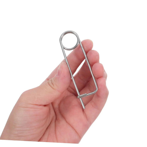 Rock Solid Heavy Duty Stainless Steel Spring Lock Pins For Farm Hitches And Industrial Gear With Unbreakable Anti Vibration Stability That Slams Down Easy held in hand.