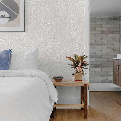Bedroom with whimsical woodland fantasy peel and stick wallpaper in cream and white, removable for easy DIY room makeovers.