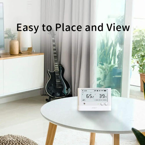 WS1-Pro Smart WiFi Temperature Humidity and Light Monitor With External Probe Expansion on table in modern living room