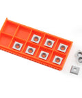 Rock Solid 11mm Square Carbide Roughing Inserts With Mounting Screws For Mini Woodturning Lathes shown in orange holder.