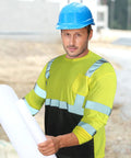 Six Pack High Visibility Long Sleeve Safety T Shirts For Men With Reflective Strips And Chest Pocket Fluorescent Yellow Hi Vis Workwear XL For Nighttime Visibility worn by man on construction site