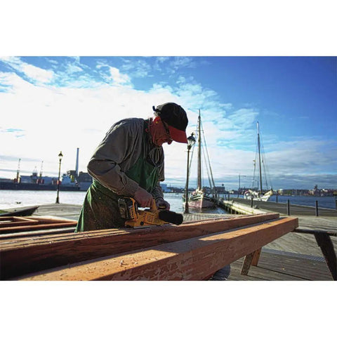 Pro Grade 20V Max Xr Brushless Cordless Planer Drops Dead Serious Amps For Zero Drag Wood Planing And Cabinet Refinishing Job Site Ready Tool Only Renewed, man using planer on wooden beam.