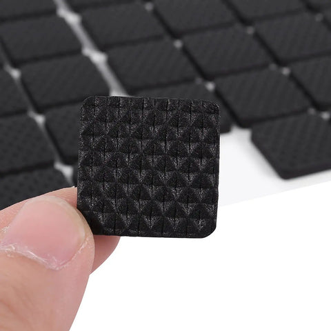 Close-up of a single pad from the 48 Pack Black Rubber Floor Protectors Self-Adhesive Non-Slip Pads for Furniture and Appliances
