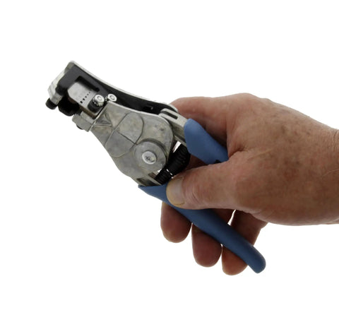 Stripmaster Manual Wire Strippers For 16 To 26 AWG Handheld Electrician Tool in hand with blue grips, side view