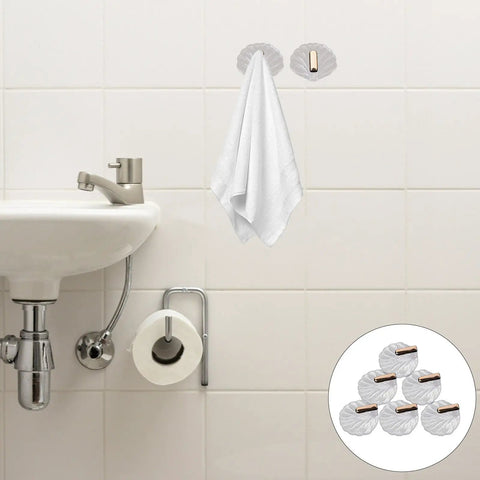 Six Pack Peel And Stick Wall Hooks With Rock Solid Hold For Zero Hassle Bathroom Setup Self Adhesive Hangers For Towels Hats Coats And Everyday Carry holding a towel in a bathroom setting.