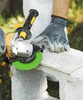 Person using Ultra-Thin 4.5 Inch Glass Cutting Disc Diamond Blade For Angle Grinder on tile outdoors