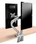 Rock Solid Dual Monitor Arms For 17 To 32 Inch Screens With Mechanical Spring Tension and Smooth Glide Aluminum Stand on a desk.