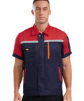Men Heavy Duty Mechanic Uniform Short Sleeve Work Shirt Built Tough Contrast Utility Top With Safety Reflective Stripes Zip Front Drop Collar Red Navy Blue front view.