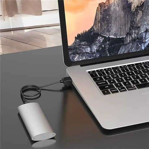 Slick Aluminum M.2 To Type C Enclosure For B Key Ssd Up To 2tb Fast Usb 3.1 Docking Station connected to laptop.