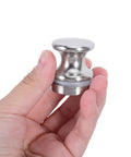 Hand holding Two Pack Glass Shower Door Handles For Homes And Offices Silver Aluminum Alloy Round Single Hole Mount Heavy Duty