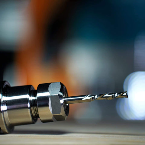 Close-up of a solid carbide spiral router bit from Five Piece CNC Router Bit Set For Serious Woodworking Enthusiasts with 1/4 inch shank.