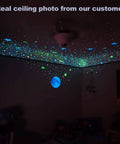 Glow In The Dark Stars Ceiling Decals 633 Realistic 3D Star Stickers creating a starry night glow in child's bedroom.