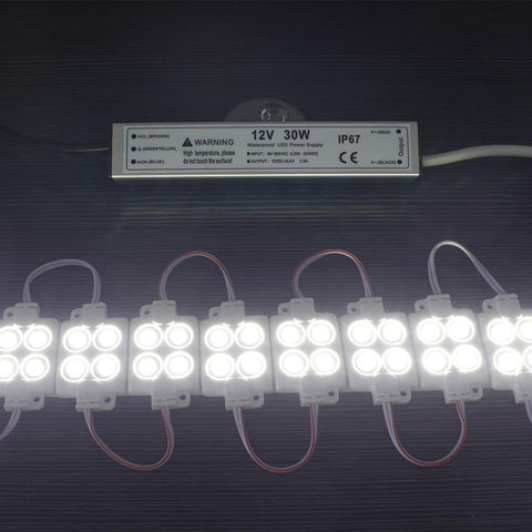 30W 12 Volt LED Power Supply IP67 Waterproof LED Driver 110V AC To 12V DC Converter with LED modules illuminated on a dark background.