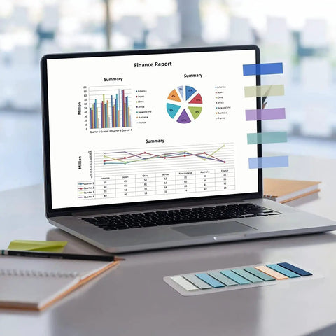 Laptop with charts and Sticky Book Tabs Set With Repositionable Book Markers, Writable Transparent Flags on desk, 200 pieces, colorful PET material.