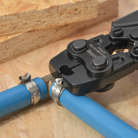 Pinch Clamp Removal Tool For PEX Cinch Clamps, Easy Grip Pro Tool removing clamps from blue PEX pipes