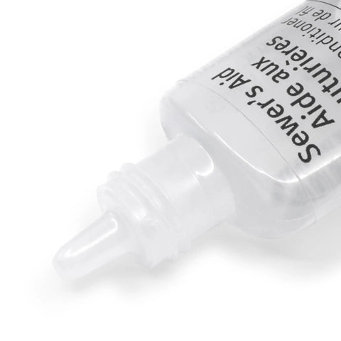 Sewer Aid Liquid Lubricant For Your Sewing Setup 0.5 Fluid Ounce Clear bottle with nozzle on white background