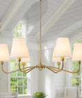 Smooth Operator 6 Light Brass Gold Chandelier With White Fabric Shades, elegant design suitable for dining room or kitchen island.