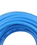 Close-up of blue polyurethane pneumatic hose, coiled, 10mm outer by 6.5mm inner diameter, 100 meter roll for compressors and tools.