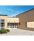 Building exterior with Crosstour 26W Carbon Outdoor Integrated LED Wall Pack With 4000K Neutral White, Bronze Finish on brick wall
