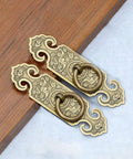 Two Pack Vintage Style Embossed Brass Drawer Pulls For Wardrobe Bookcase And Double Doors In Antique Bronze Finish on wood