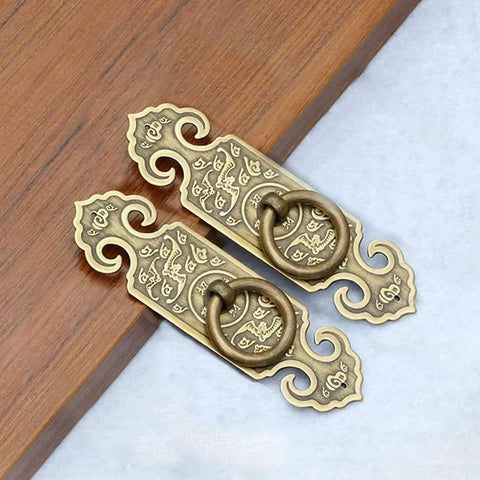 Two Pack Vintage Style Embossed Brass Drawer Pulls For Wardrobe Bookcase And Double Doors In Antique Bronze Finish on wood
