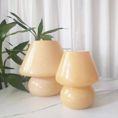 Swirl Mushroom Glass Lamp In Striped Pink, Hand Blown Translucent Murano Style Table Bedside Light on white surface with plants