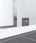 Solid Chrome Shower Glass Clamp, Heavy Duty Brass Clip For Frameless Panels, mounted beside glass panel in a bathroom setting.