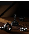 Pro Level 58mm Adjustable Espresso Puck Distribution Tool For Standard Portafilters set on brown coffee grounds.