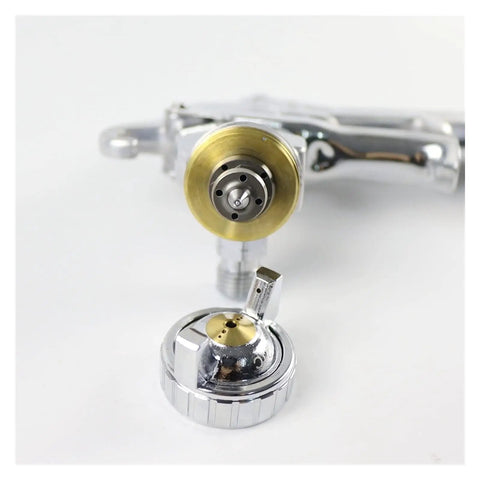 Close-up of the nozzle and gravity feed cup of the Pro Grade Mini Pneumatic Spray Gun Featuring Gravity Feed And 1.3 Mm Nozzle.