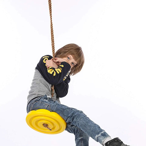 Child playing indoors on Daisy Disc Tree Swing With Rope Seat For Backyard Play Blue Monkey Swing Style 11 Inch Disc 6.5 Foot Rope Keeps It Safe And Fun For Lil Adventurers Indoors Or Outdoors