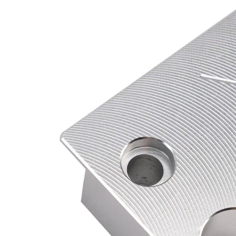 Close-up of metal Reservoir Body And Shaft Clamp 803 00 208 for Float X Shock Rebuild Vise Clamp, showing detailed grooves.