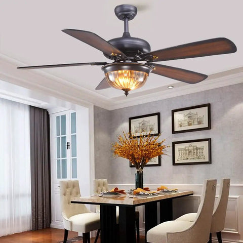 Classic Antique Ceiling Fan With Integrated Led Light And Wireless Remote For Chill Summer Airflow in dining room.