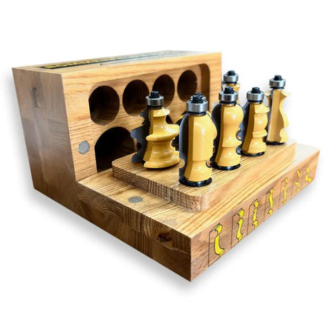 Heavy Duty Architectural Molding Router Bit Set For Skilled Woodworkers Crafting Knockout Baseboards Door Casings And Chair Rails, 7-gold coated router bits in a wooden holder.