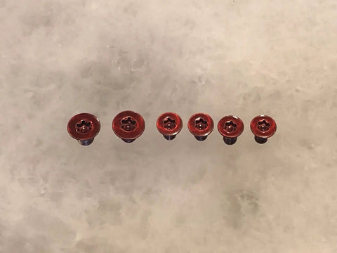 Premium Red Replacement Scale And Pivot Torx Screws For Spyderco Manix 2 G10 Manix 2 XL Set Of 6 viewed from above on white background.