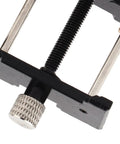 Close-up of Two Piece Watch Movement Holder Kit with non-slip base and repair tool for watchmakers' jewelry making.