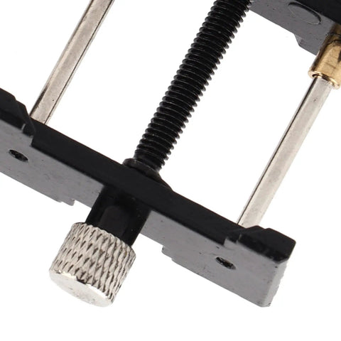 Close-up of Two Piece Watch Movement Holder Kit with non-slip base and repair tool for watchmakers' jewelry making.
