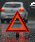 DOT Approved Vehicle Safety Triangles Three Pack With Carry Case Emergency Reflective Warning Signs on wet road in rain.