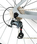 Close-up of Tiagra 20-speed drivetrain on Toray T800 Carbon Frame Road Bike Model H With Tiagra 20 Speed Drivetrain, Ultra Lightweight 18.7 Lb Build, Size 52 Fits 5ft 8in To 5ft 9in, Celeste Finish, Minimal Logo Ready, Limited Lifetime Warranty On Carbon Frame.