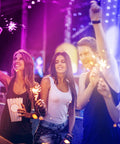 Group of friends celebrating under Lit 32.8 Foot RGB LED Strip Lights For Bedroom Color Changing Glow, Great For Room Decor, Parties And Halloween