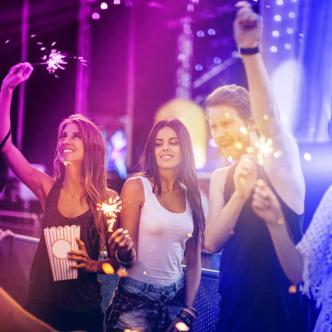 Group of friends celebrating under Lit 32.8 Foot RGB LED Strip Lights For Bedroom Color Changing Glow, Great For Room Decor, Parties And Halloween