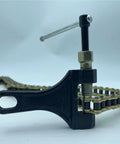 428H 120 Link Gold Motorcycle Chain With Master Link And Breaker Kit for heavy duty performance, close-up view with breaker tool.