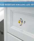 Fresh Daisy Flower Stainless Steel Drawer Knobs Set of 2 1.1 Inch Round Cabinet Handles with Rust Proof Finish on a white cabinet.
