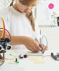 Child using Copper And Zinc Electrode Strips 20 Pcs DIY Science Kit For Classrooms And Labs, Fruit Battery Projects