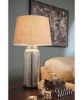 Sharmayne 30.75 Inch Clear Glass Table Lamp With Transparent Glass Shade Vintage Casual Style on wooden side table