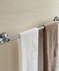 Stainless steel Insta Mount 24 Inch Towel Bar No Tools No Drilling Mounts Anywhere with white and brown towels on tiled wall.