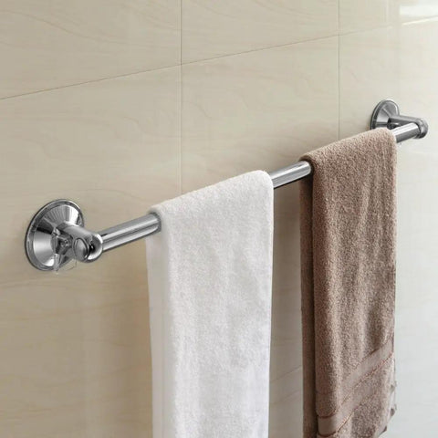 Stainless steel Insta Mount 24 Inch Towel Bar No Tools No Drilling Mounts Anywhere with white and brown towels on tiled wall.